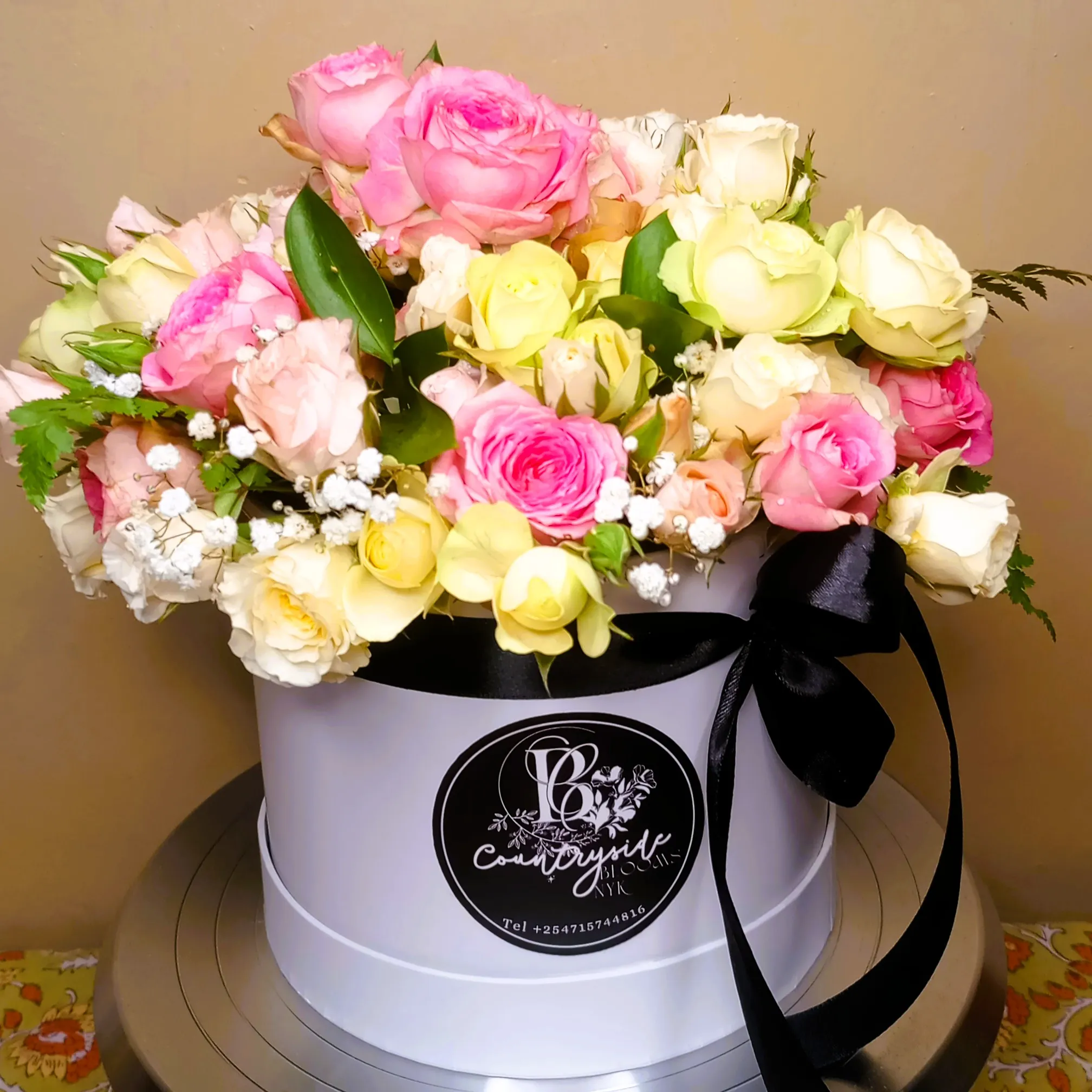 Classic vanilla celebration cake with red roses